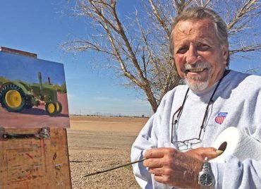 artist painting farm picture