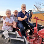 Caywood family on tractor