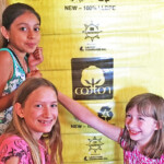 children posing with cotton bale
